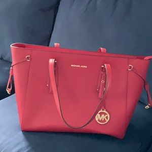 16” x 10” beautiful red bag. Has multiple pockets